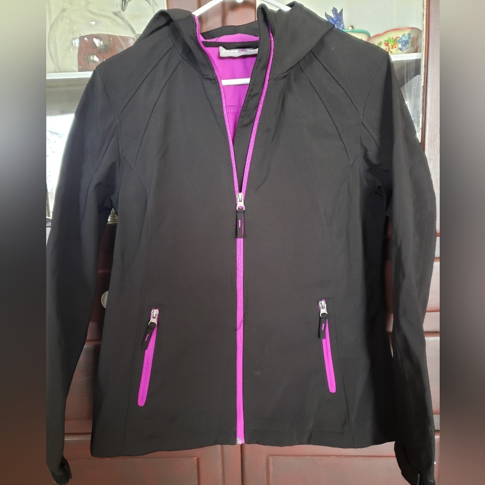 Free Tech softshell jacket, black with purple interior and zippers. Size M (8-10
